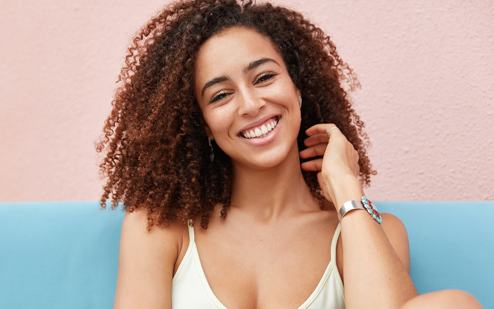 Black girl smiling and waiting for her Cary or Apex Orthodontist