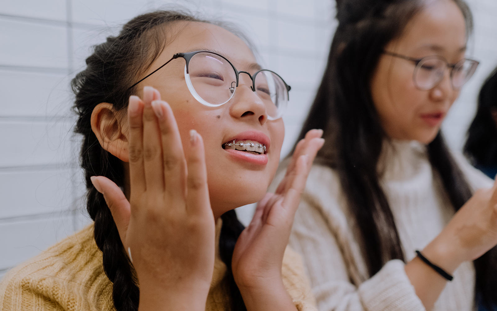 Happy young girl with clear braces