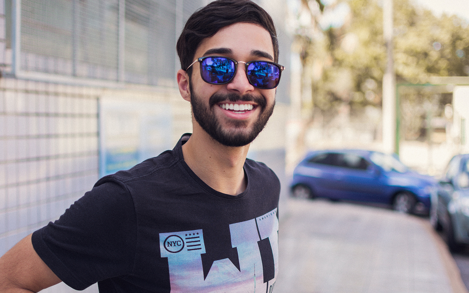 College student with sunglasses on sidewalk