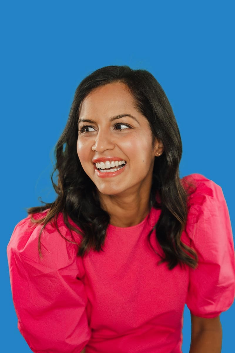 tooth-by-tooth-orthodontics-tooth-by-tooth-dr-patel-retainers-dark-woman-patient-smiling-candid
